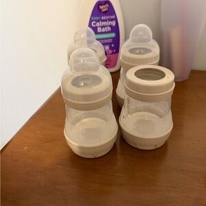 Set of Baby Bottles with Cream Accents